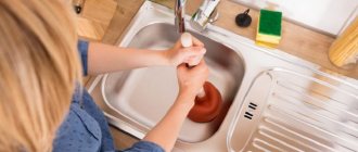 girl unclogs a clogged sink in the kitchen