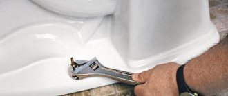 Attaching the toilet to the floor